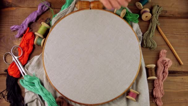 Embroidery needlework background Linen in hoop mockup. Colorful floss thread scissors card tag in child hands. Handmade ethnic clothes towel tablecloth.New normal lockdown hobby crafts stitch tutorial - Footage, Video