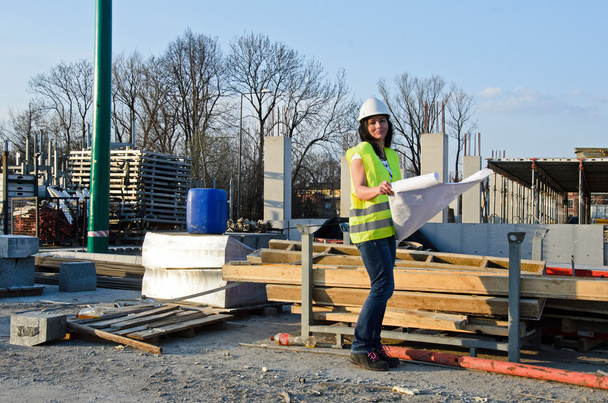 Young female architect at the construction site of the construct - Photo, Image