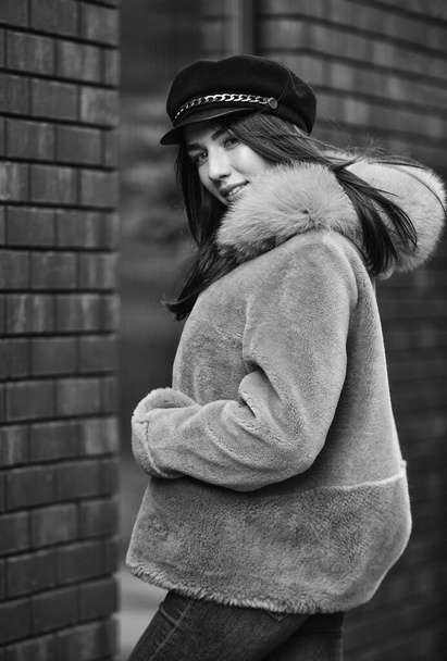 Winter clothes. Stay warm and fashionable. Glamorous lady. Woman wear furry coat. Fashion as unique as you are. Pink sheepskin coat. Fancy chic coat. Natural wool sheepskin coat. Fur on hood - Фото, зображення