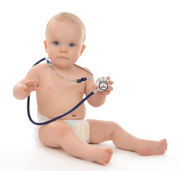 Infant child baby toddler sitting with medical stethoscope  - Foto, imagen