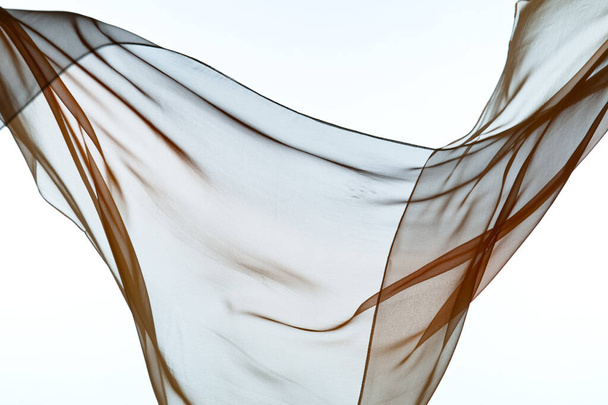Smooth elegant transparent cloth separated on white background. - Foto, imagen