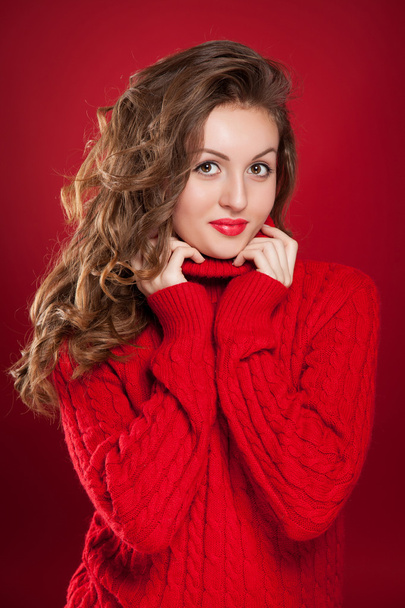 beautiful brunette girl wearing red sweater  - Photo, image