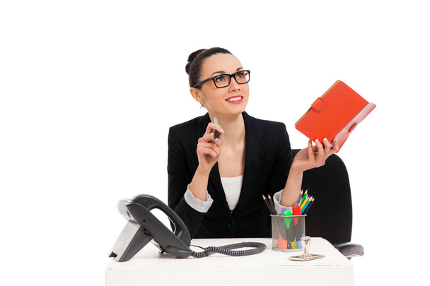 businesswoman sitting in office chair and writing in notebook  - Foto, Imagem