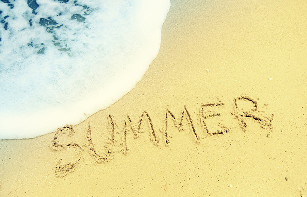 summer text drawn on sanded beach - Photo, image
