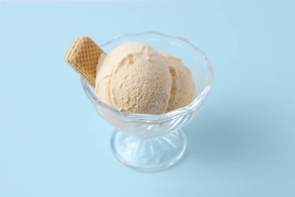 ice cream with wafer on dessert glass isolated on blue background - Zdjęcie, obraz
