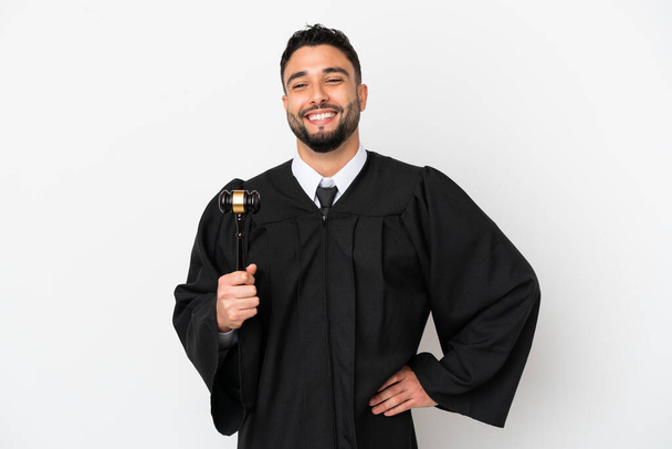 Judge arab man isolated on white background posing with arms at hip and smiling - Photo, image