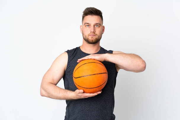 Russian handsome man isolated on white background playing basketball - Zdjęcie, obraz