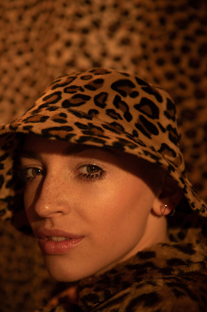 Girl wearing leopard panama posing while looking at the camera - Fotografie, Obrázek
