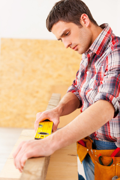 Handyman working with wood in workshop - Fotó, kép