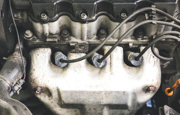 Spark plug in old car engine. Inner details of machine. Repairing of vehicle. - Foto, imagen