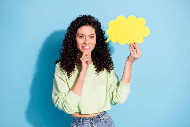 Photo of pretty positive girl arm on chin hold paper cloud figure thinking isolated on blue color background - Фото, изображение