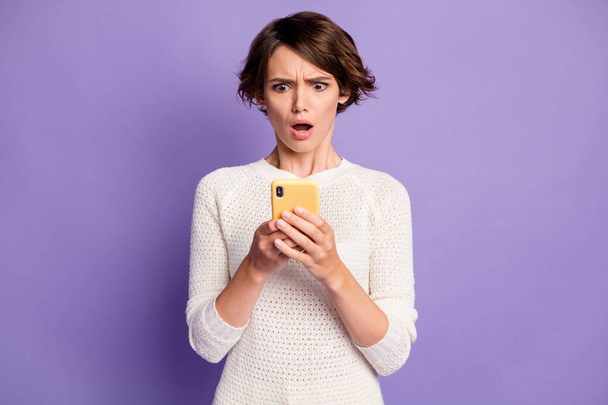 Photo portrait of nervous frustrated girl reading fake news mobile phone isolated on pastel purple color background - Photo, Image