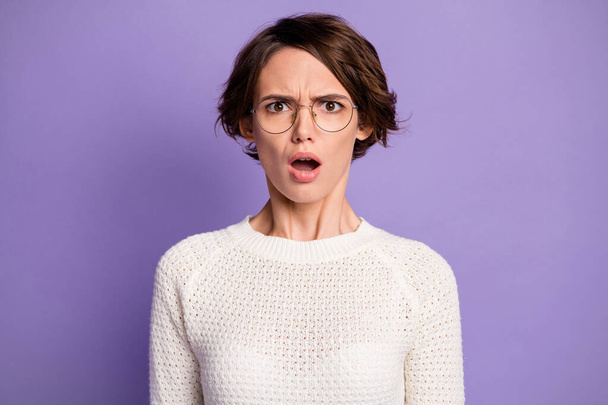 Photo portrait of clueless smart girl wearing glasses misunderstanding isolated on bright violet color background - Foto, Imagem