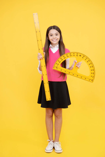 Early development. happy teenage girl with protractor ruler. back to school. trigonometry stationery. kid study mathematics. stem disciplines. education for child. measuring angle degree. measurement. - Photo, Image