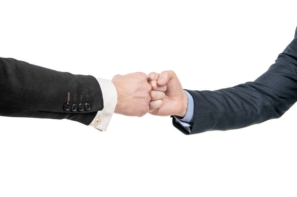 partner relationship. male friendship. businessmeeting. two pumping fist. business deal. partnership and cooperation. welcome gesture. support hands gesture of men after successful negotiations. - Foto, imagen