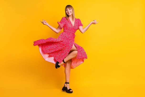Full length photo of stunning attractive happy young woman raise hands skirt dress fly isolated on yellow color background - Foto, Imagem