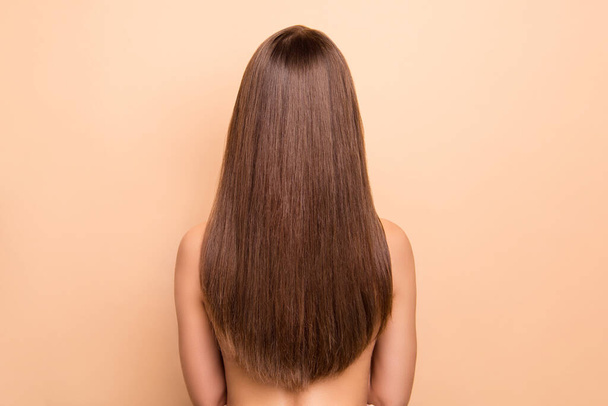 Rear behind profile portrait of nice long healthy hair lady no clothing isolated on beige color background - Foto, Bild