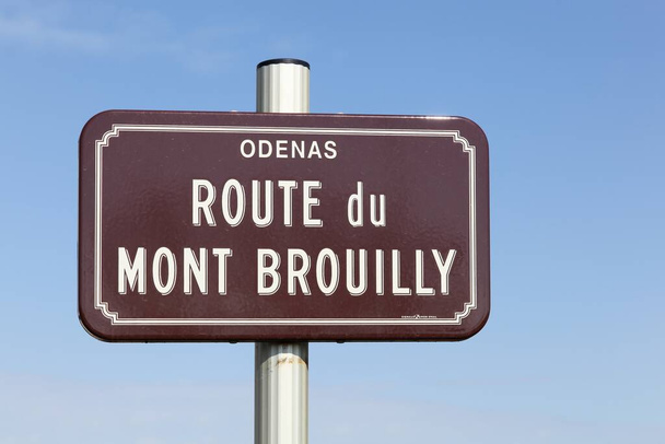 Road sign with route du Mont Brouilly in Odenas, Beaujolais, France - Photo, Image