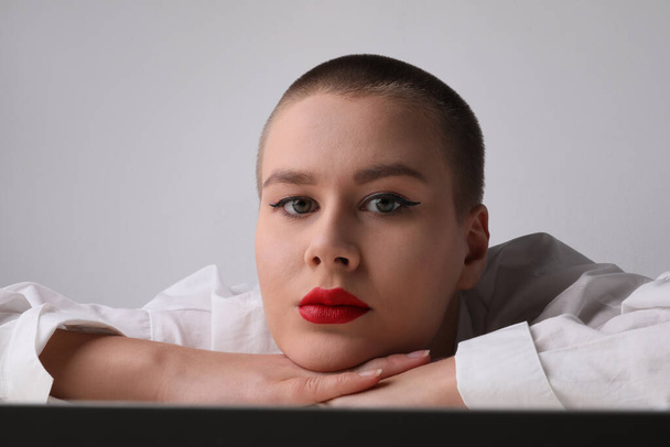 Bald woman, with pensative expression posing in the studio. Isolated. - Foto, Imagem