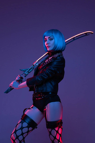 Futuristic woman in cyberpunk style and fight pose - Fotografie, Obrázek