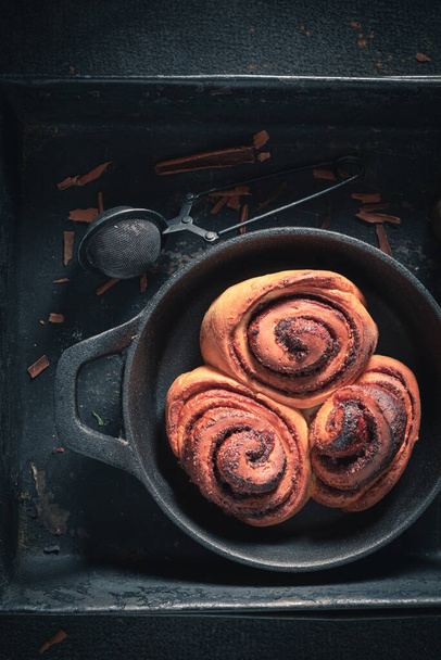 Traditionally cinnamon rolls with cocoa and sugar. Christmas snack. Swedish cuisine. - Foto, immagini