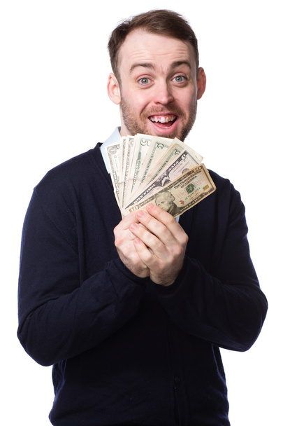 Homem excitado segurando um punhado de dinheiro
 - Foto, Imagem