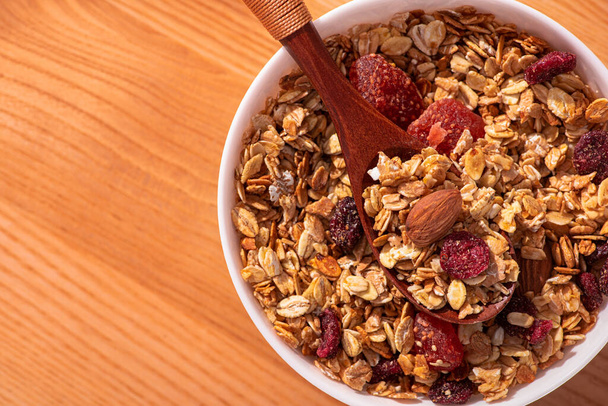Closeup of granola with nuts and dried fruit. Top view. - 写真・画像