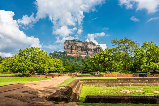 Lion Rock fortress with the Gardens of Sigiriya in the foreground, Sri Lanka. - Fotoğraf, Görsel