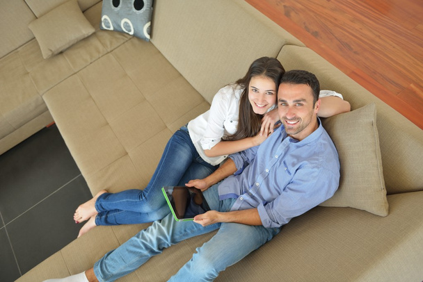 Couple at home using tablet computer - Photo, Image