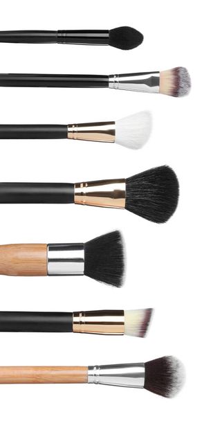 Set with different makeup brushes for applying cosmetic products on white background. Vertical banner design - 写真・画像