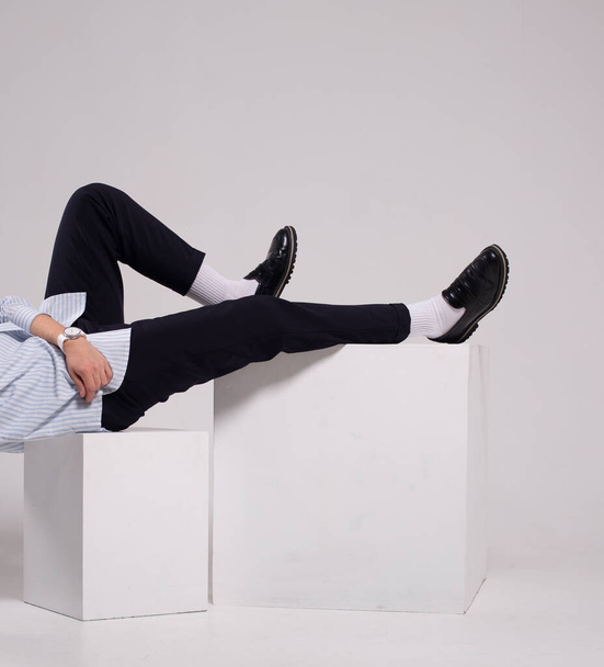 fashion man legs skinny short pants socks and shoes on white cube - Foto, immagini