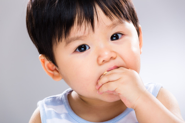 Baby boy eating close up - Фото, изображение