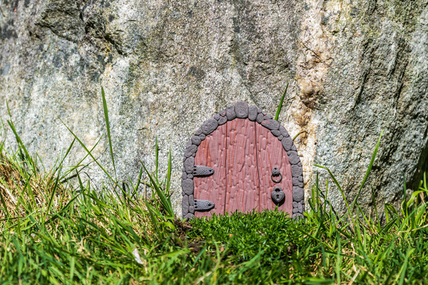 elf house door made from clay in huge stone fantasy world. - Fotoğraf, Görsel