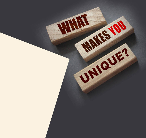 What makes yiu unique - phrase on Wooden blocks. Business or carees success concept. - Φωτογραφία, εικόνα