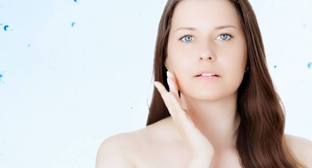 Rejuvenation skincare and beauty ad, beauty face portrait of young woman with healthy clean skin, blue cosmetic liquid drops on background - Photo, Image