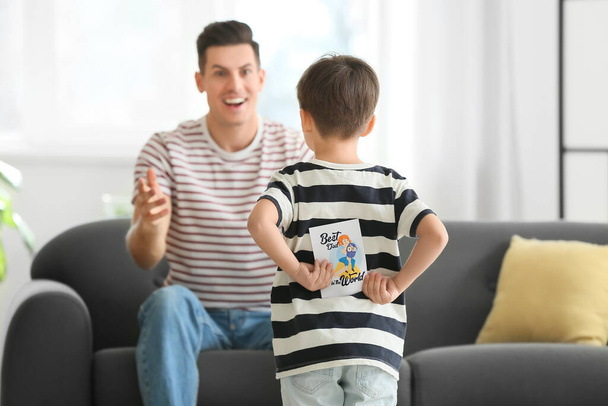 Little boy greeting his dad on Father's Day at home - Φωτογραφία, εικόνα