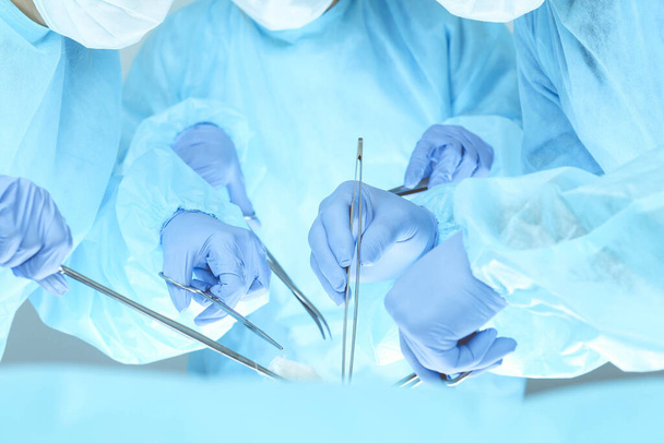 A group of surgeons is operating at the hospital. Health care concept - Photo, image