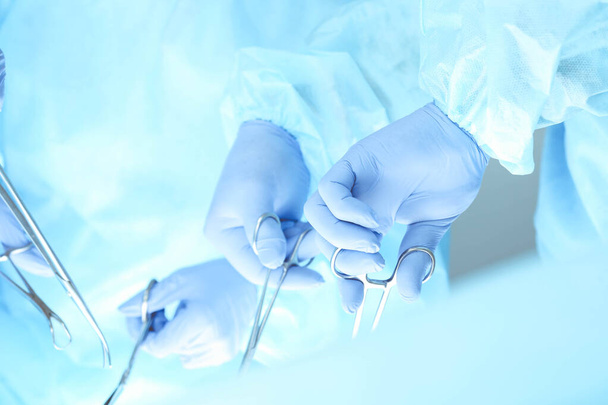 A group of surgeons is operating at the hospital, close-up of hands. Health care concept - Foto, Bild
