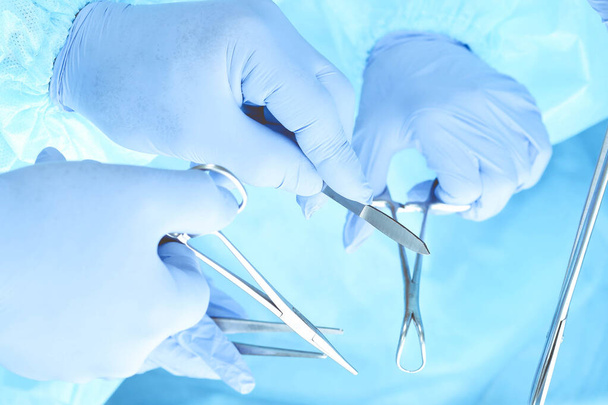 A group of surgeons is operating at the hospital, close-up of hands. Health care concept - Foto, afbeelding