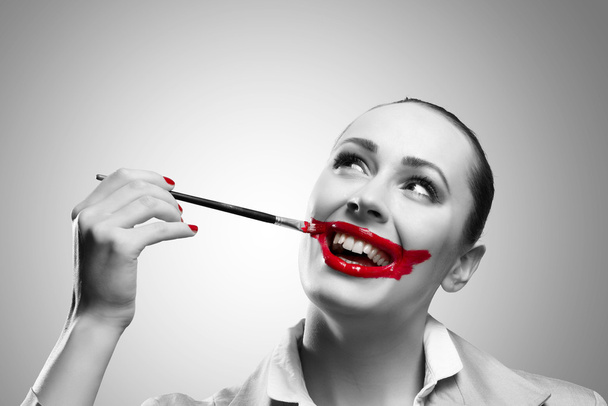 Conceptual Image with Vivid Red Mouth - Photo, image