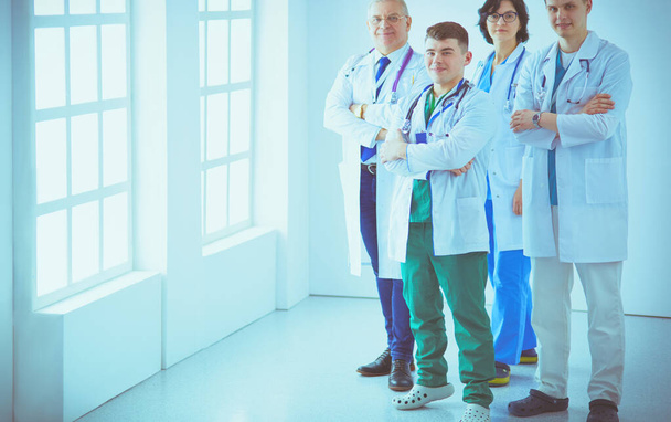 Successful medical team. Confident doctors team standing together and smiling - Фото, зображення