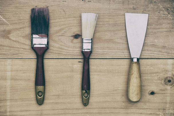 paintbrush tools on wooden background - vintage Filtered.  - Foto, Imagem