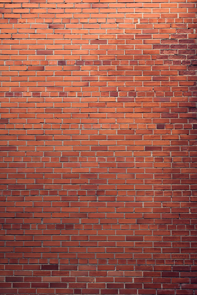 Vertical red bricks background. A part of wall of the building - Photo, Image