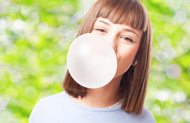 Girl doing with chewing gum - Foto, afbeelding