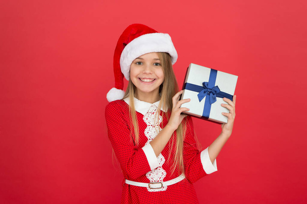 My gift from Santa. Happy girl hold gift box. Little child smile with wrapped gift. Christmas gift. St. Nicholas feast. Boxing day. New year surprise. Holiday greeting. Festive season - Zdjęcie, obraz