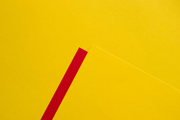 Yellow on yellow background with red stripe - Photo, Image