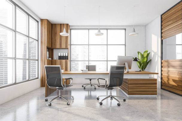 Light wooden office manager room interior with table and desktop computer, black armchairs on concrete floor, front view. Windows with city view on skyscrapers, 3D rendering - Foto, Imagen
