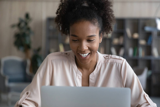 Happy young african american woman working on computer. - Photo, Image
