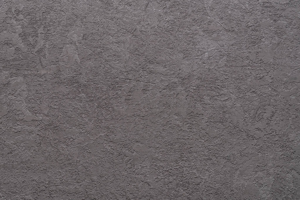 Texture de mur gris plâtré rugueux avec des rayures. Surface de stuc rugueux en béton rayé. Architecture abstraite stuc backdround. Mur de ciment grossier comme élément de conception vide. Cadre complet. Gros plan. - Photo, image