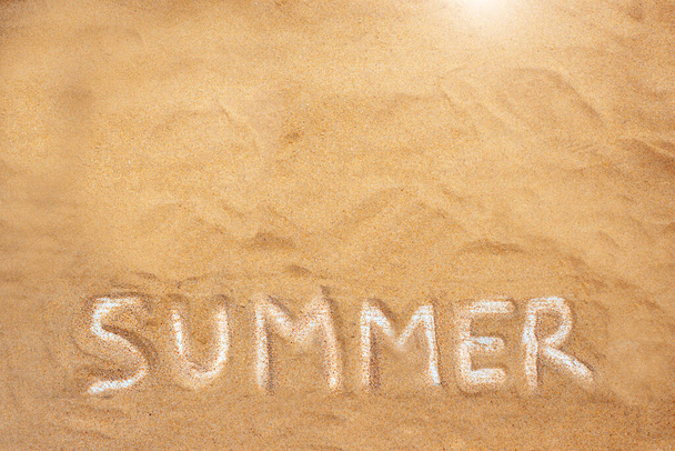 Sandy background with the word "summer". Summer background - Fotó, kép
